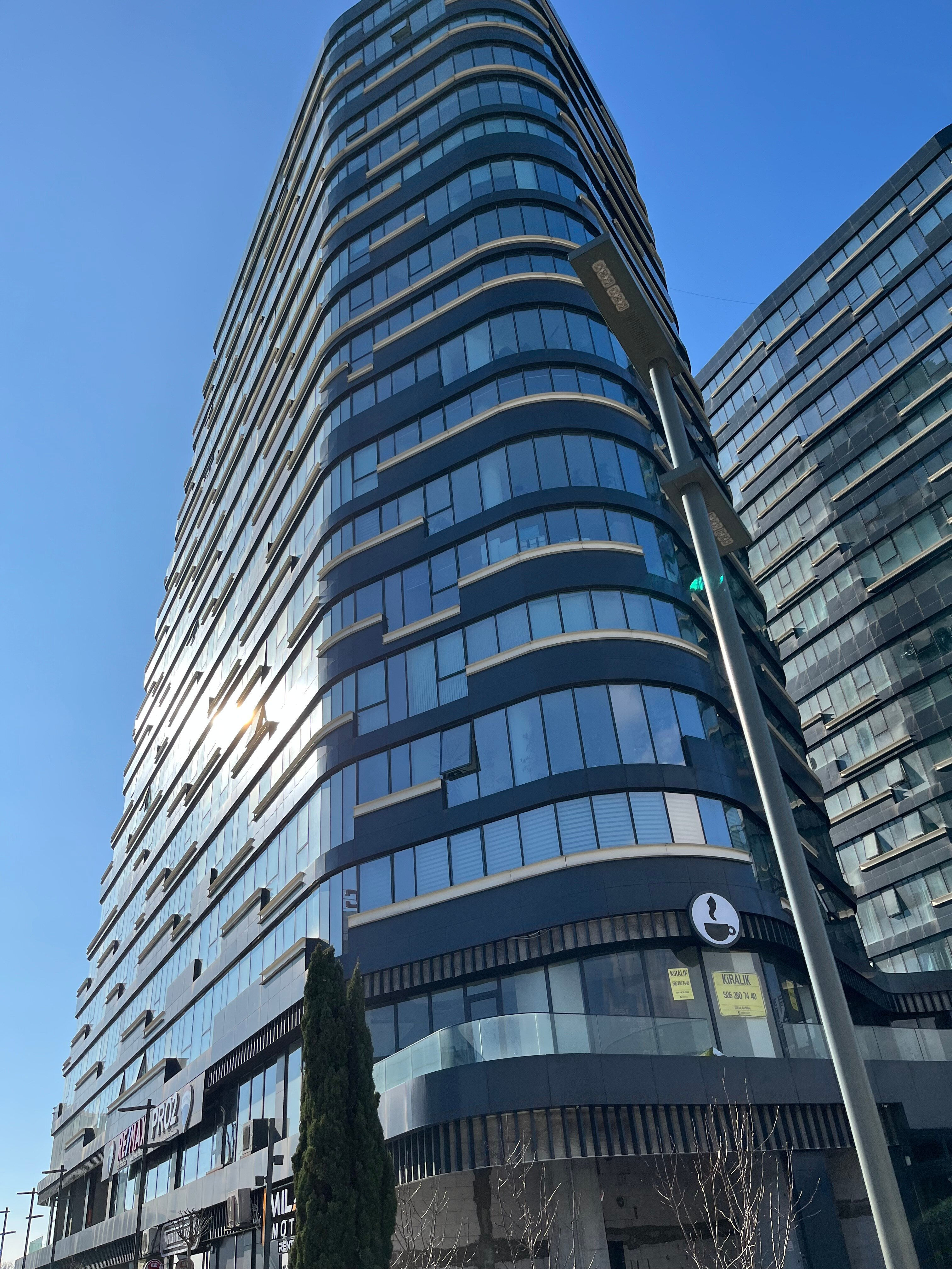 Modern office building representing Adwait Technology