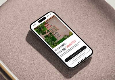 Smartphone mockup showing a minimalist mobile app login screen with an aerial background image.
