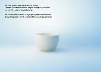Minimalist UI with white cup and black text on a blue gradient background.