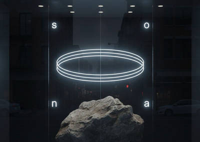 Dark minimalist UI layout with glowing white neon rings and a central textured rock.