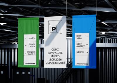 Overhead hanging directional banners in green, white, and cyan blue displaying the Perspectives logo inside a 3D perspective wireframe room.