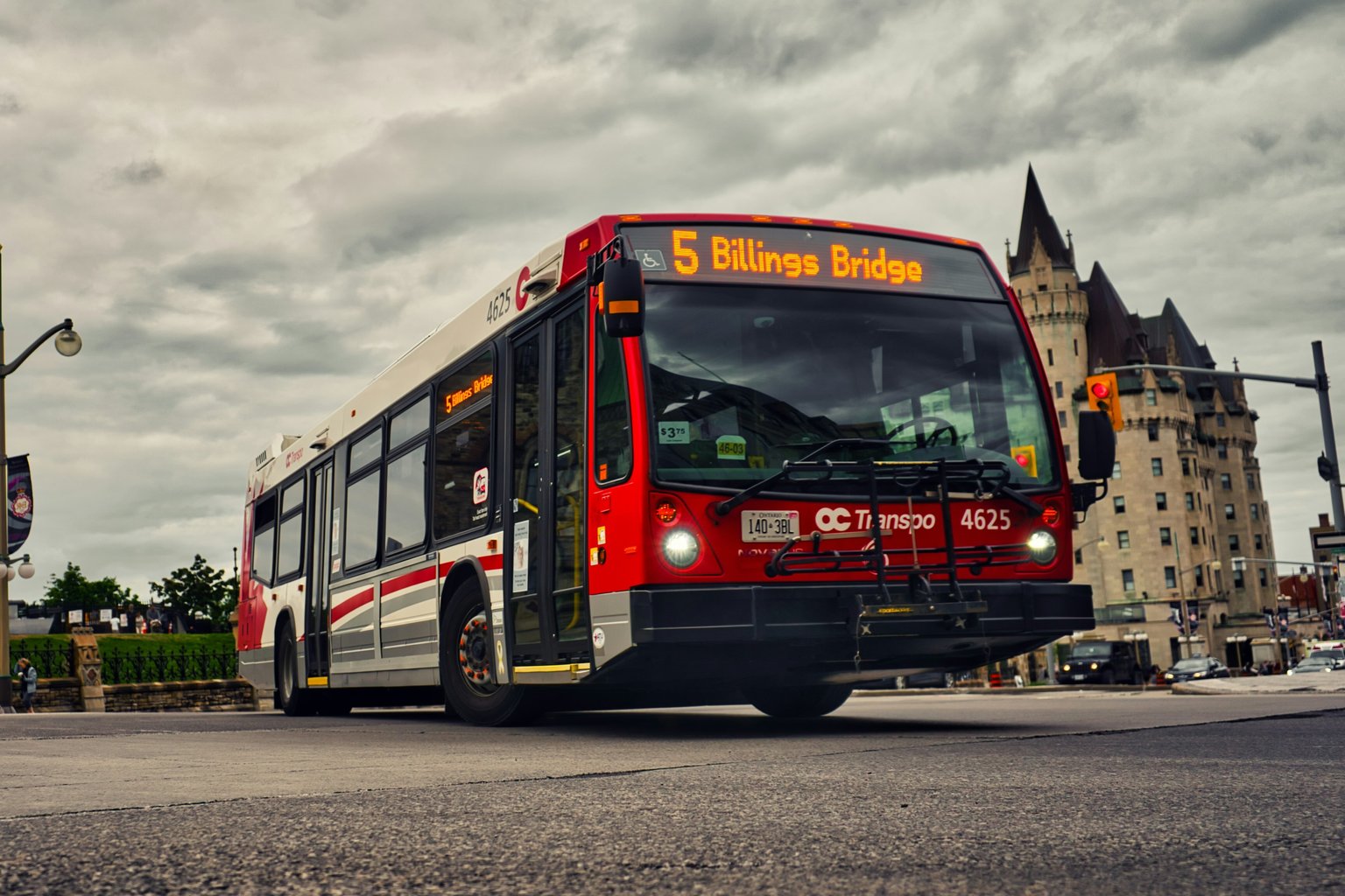 Reg public bus crossing in front of the Faimont Laurier Castle in Ottawa