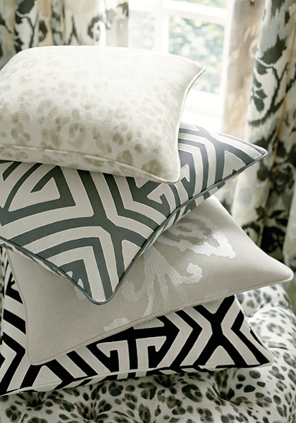 A stack of throwpillows in contrasting prints