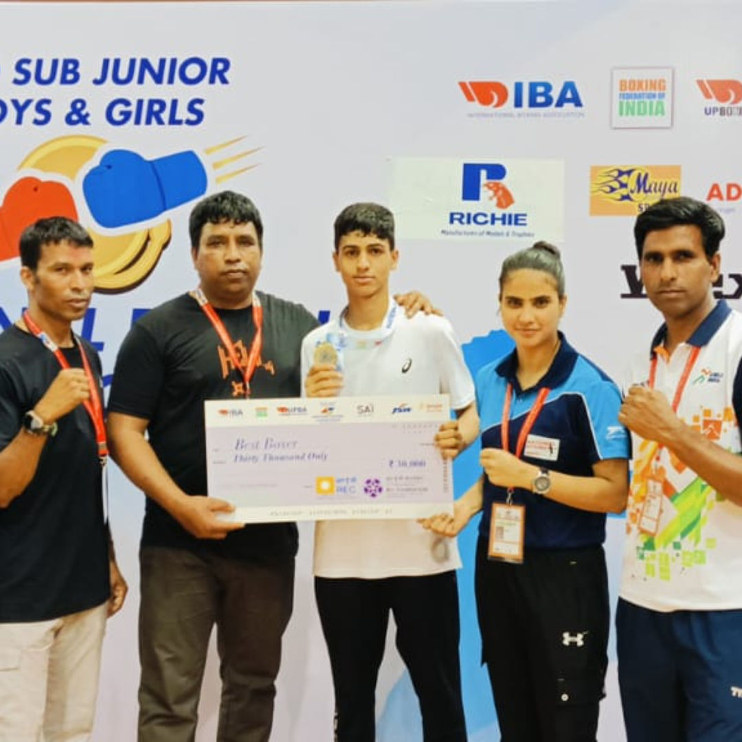 A group of young boxers celebrating.