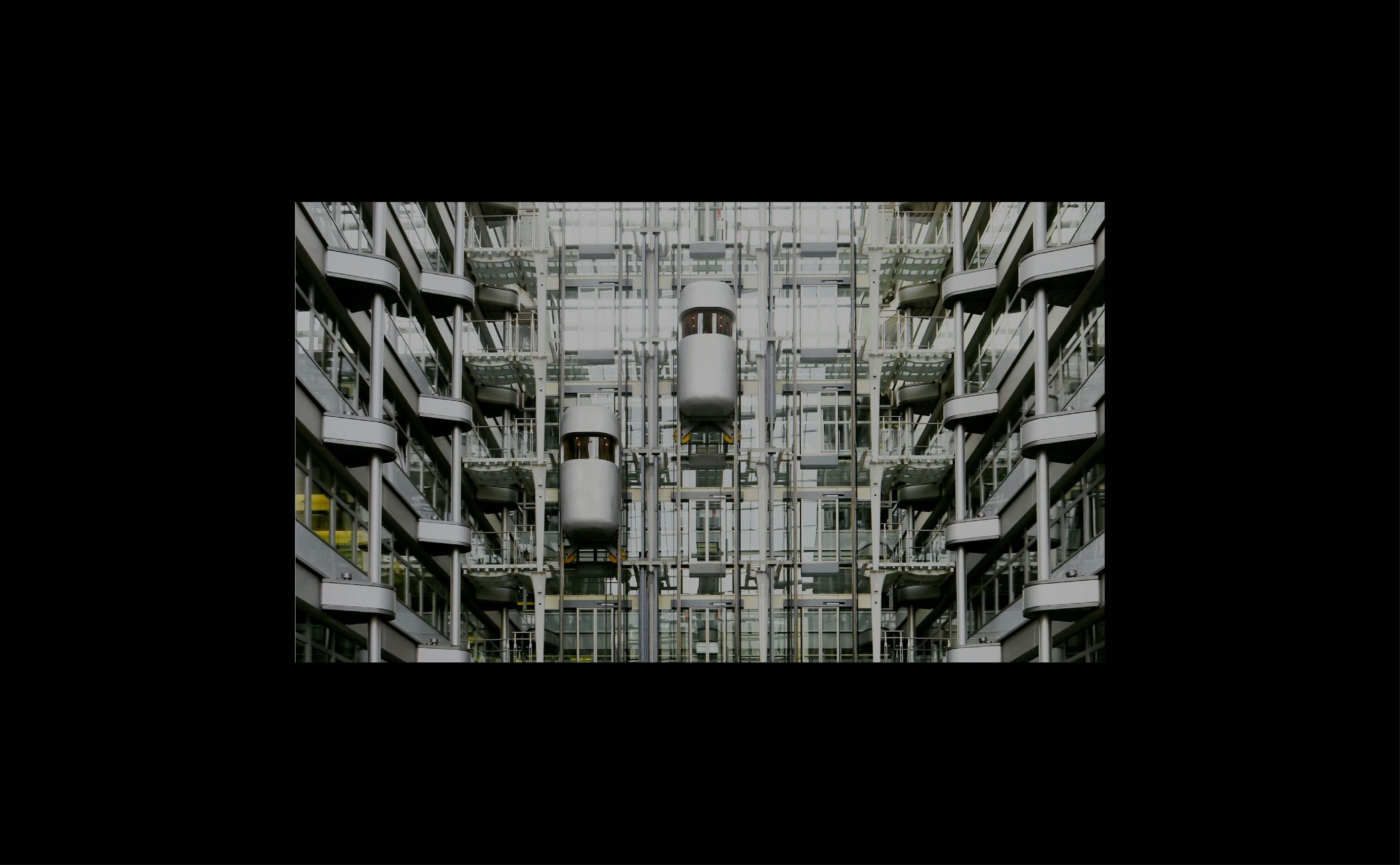 Panoramic glass elevator offering 360-degree views in a modern building