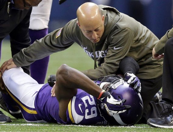 Minnesota Vikings head trainer Eric Sugarman, pictured attending to a Vikings player in 2013, had tested positive for the coronavirus.