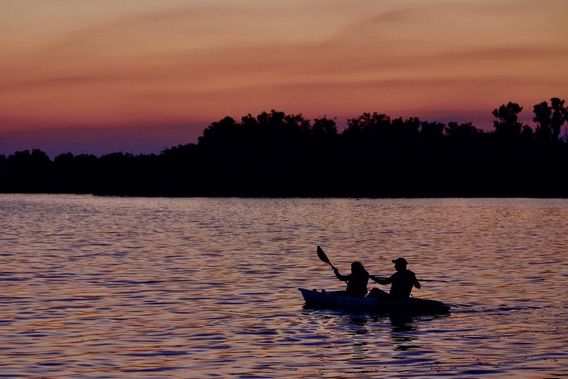 These folks were lucky enough to be paddling under the sunset in the photo above.