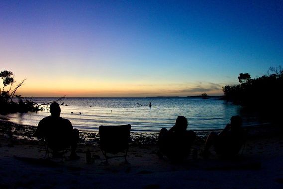 Watching the sunset from lounge chairs.