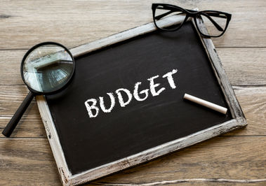 photo of a blackboard with the word budget written
