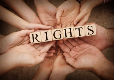 Group of Children's Hand Holding Wooden Sign Rights