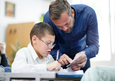 Teacher Helping a Student