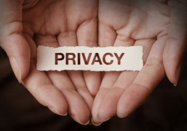 Image of Hands Holding a sign that says Privacy