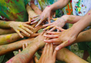 Group of People covered in paint