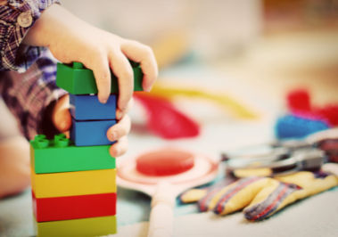 Image of Child Playing with with toy Blocks