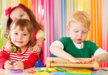 Image of Three Children Playing with Toys