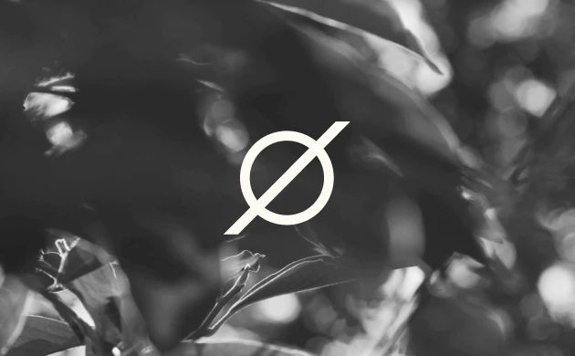 centered logo over different leaves with a black & white filter