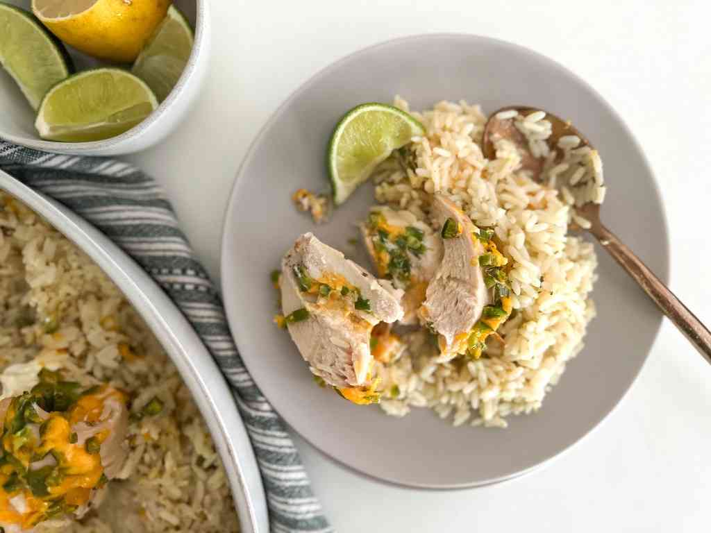 Jalapeño Popper Chicken on a plate with cilantro lime rice. 