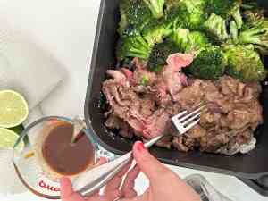Turning the beef and broccoli half way through cooking.