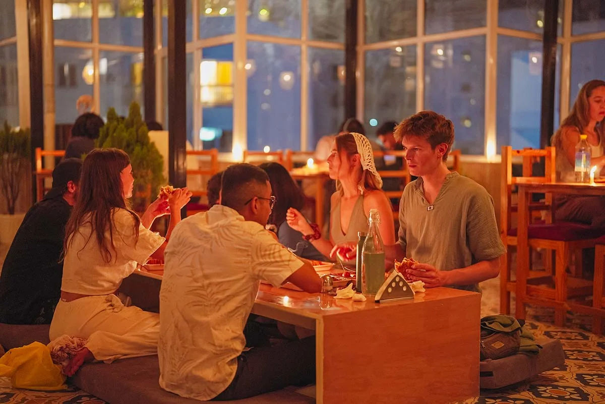 Students having candle light dinner
