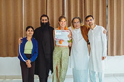 Karen Somers, student of Nirvana Yoga School receiving her 200 hour Hatha Ashtanga Vinyasa YTTC certification