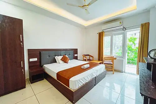 Private balcony room accommodation at Nirvana yoga school
