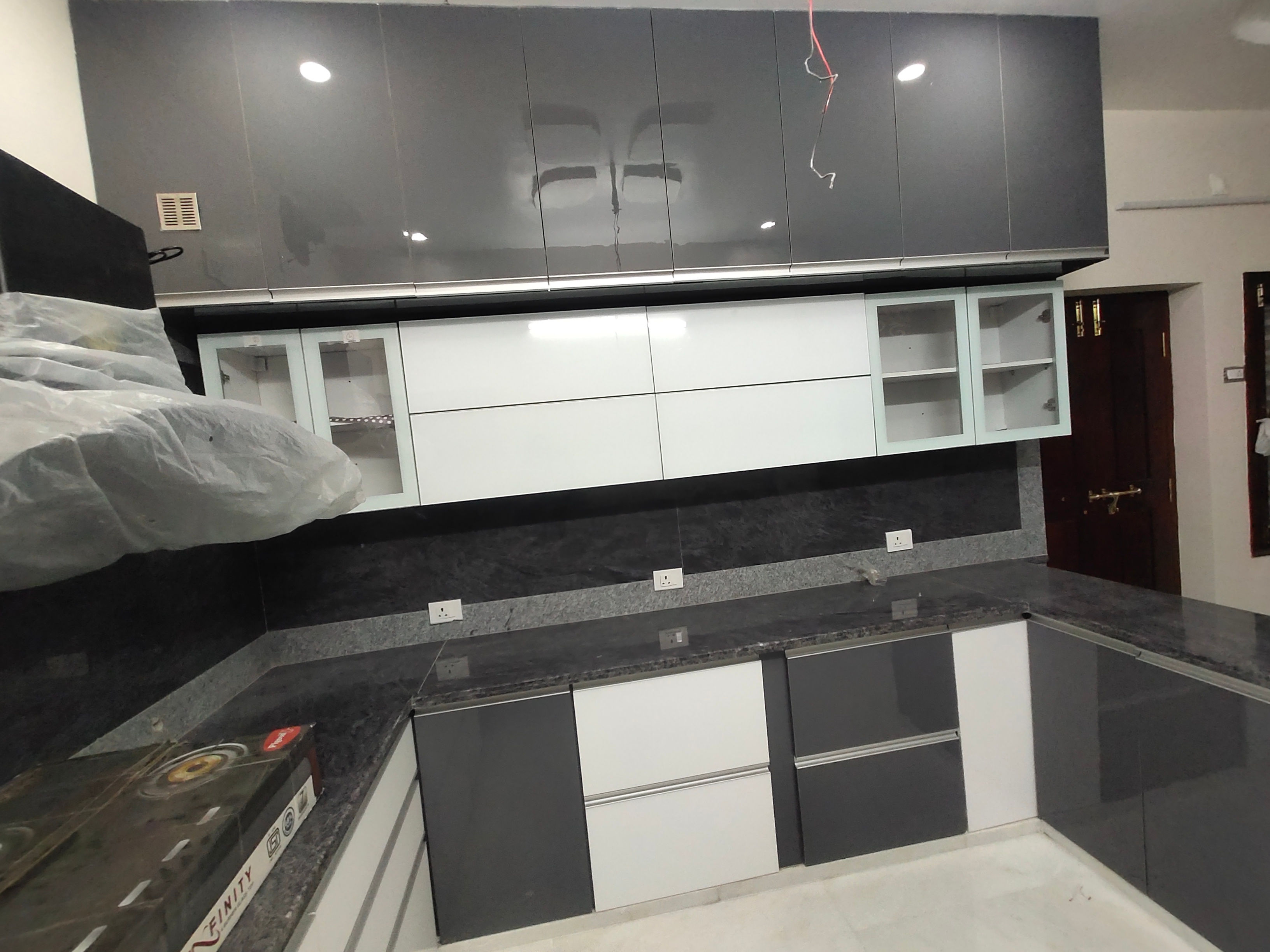 Modern U-Shaped Modular Kitchen by Design And Build Interiors