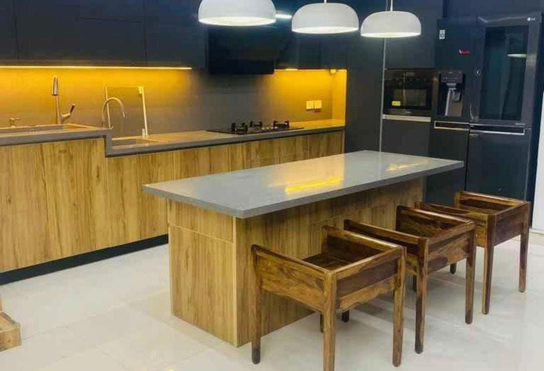 Elegant Island Kitchen Design with Brown Cabinets & Lemon-Yellow Lighting