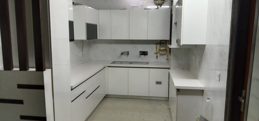 Elegant White U-Shaped Modular Kitchen by Royal Kitchen Interiors