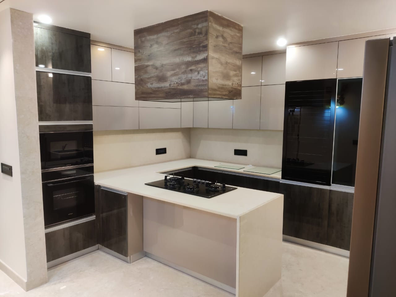 White U-Shaped Kitchen Design with Black Cooktop