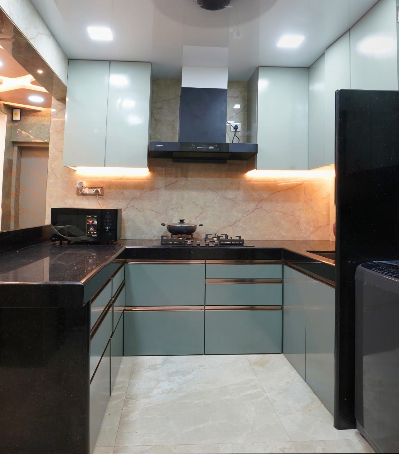 U-Shaped Modular Kitchen in Slate Gray and White with Striking Lighting