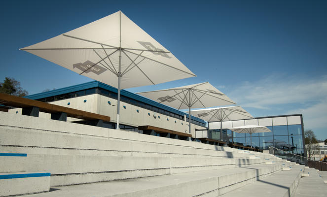 Modern terrace with large white parasols.