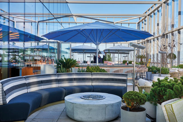 Blue giant parasol on rooftop bar