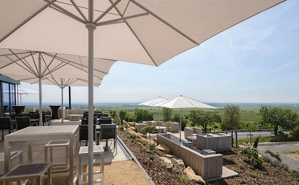 Patio with beige parasols