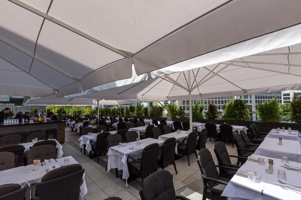 Patio with beige parasols