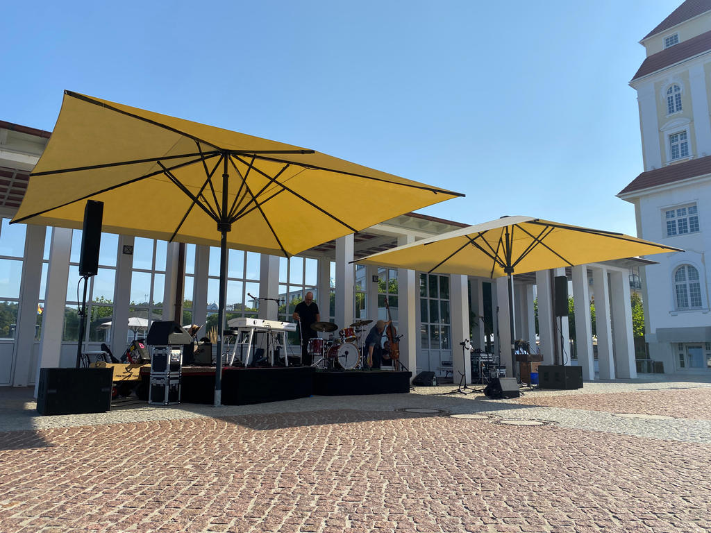 Public area with yellow parasols