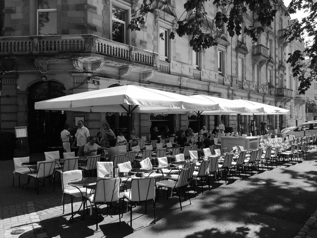 Patio with beige parasols