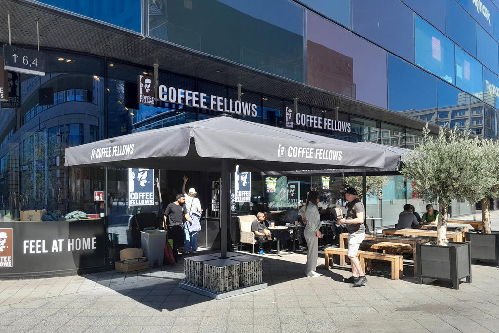 Parasol from Coffee Fellows offers shaded seating on the outdoor terrace