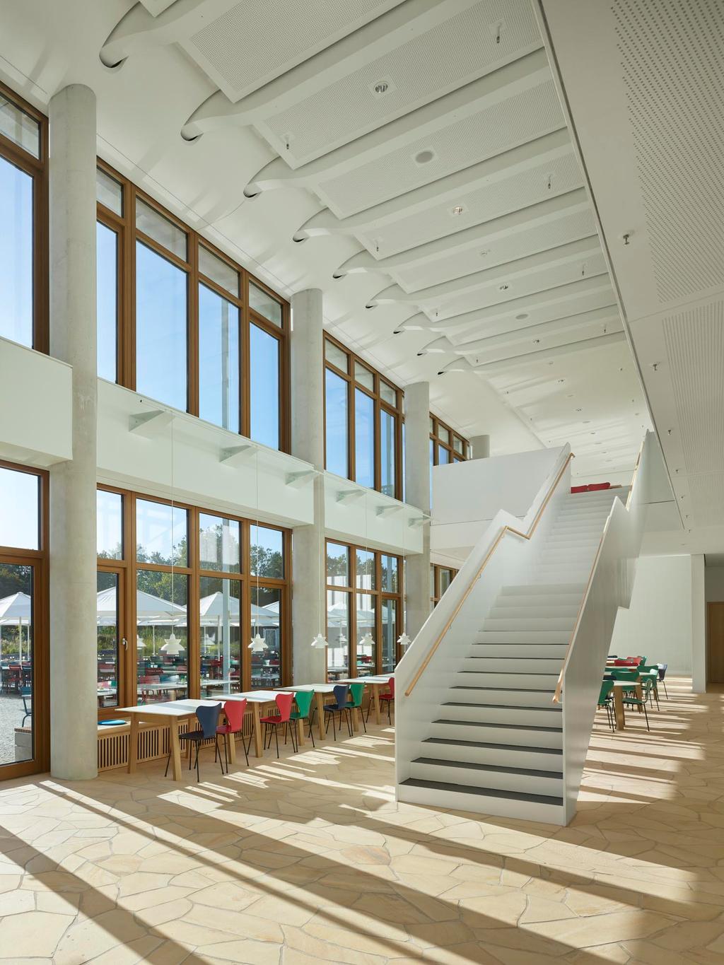 DM Headquarter Drugstore, Karlsruhe with white SCHATTELLO parasols Modern building with terrace by the water and white parasols