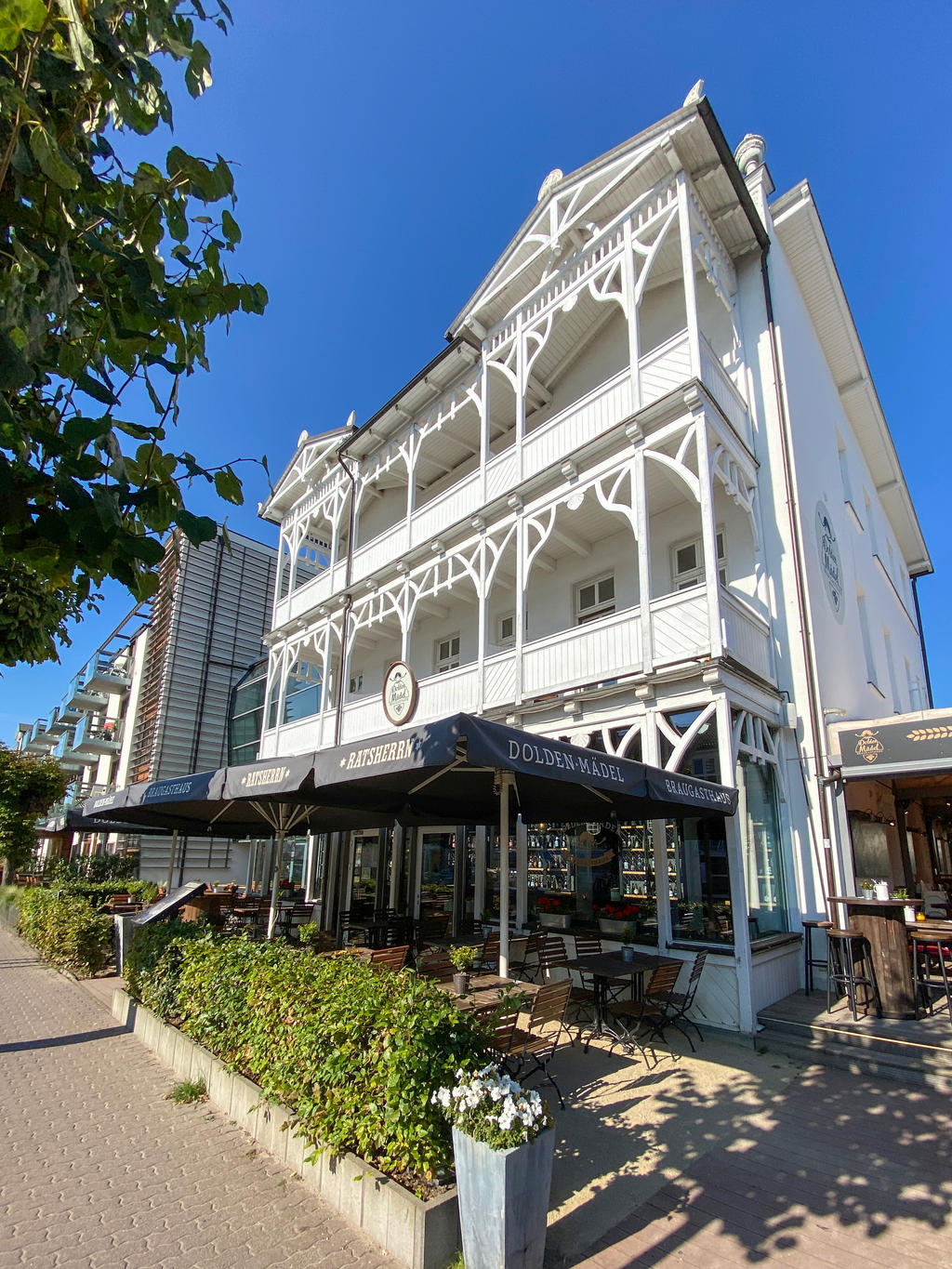 Brewery restaurant with dark-grey parasols