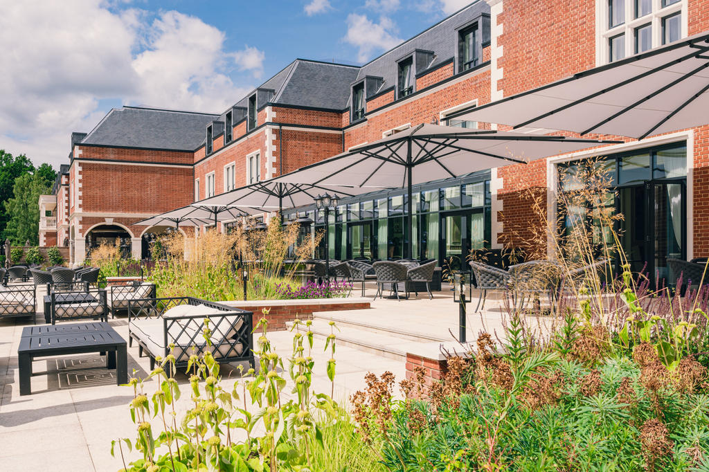 Terrace with white parasols