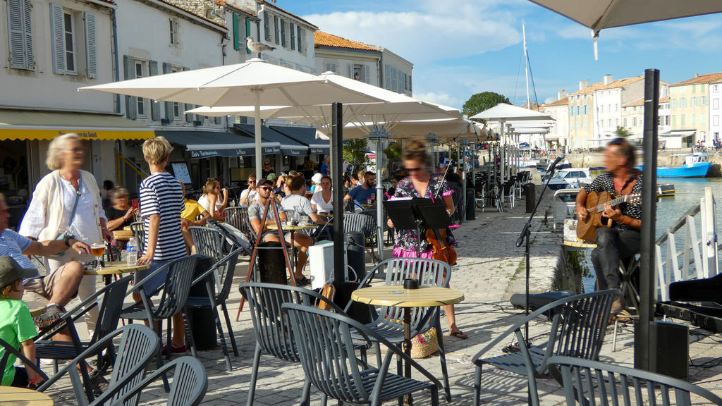 Terrace with white parasols