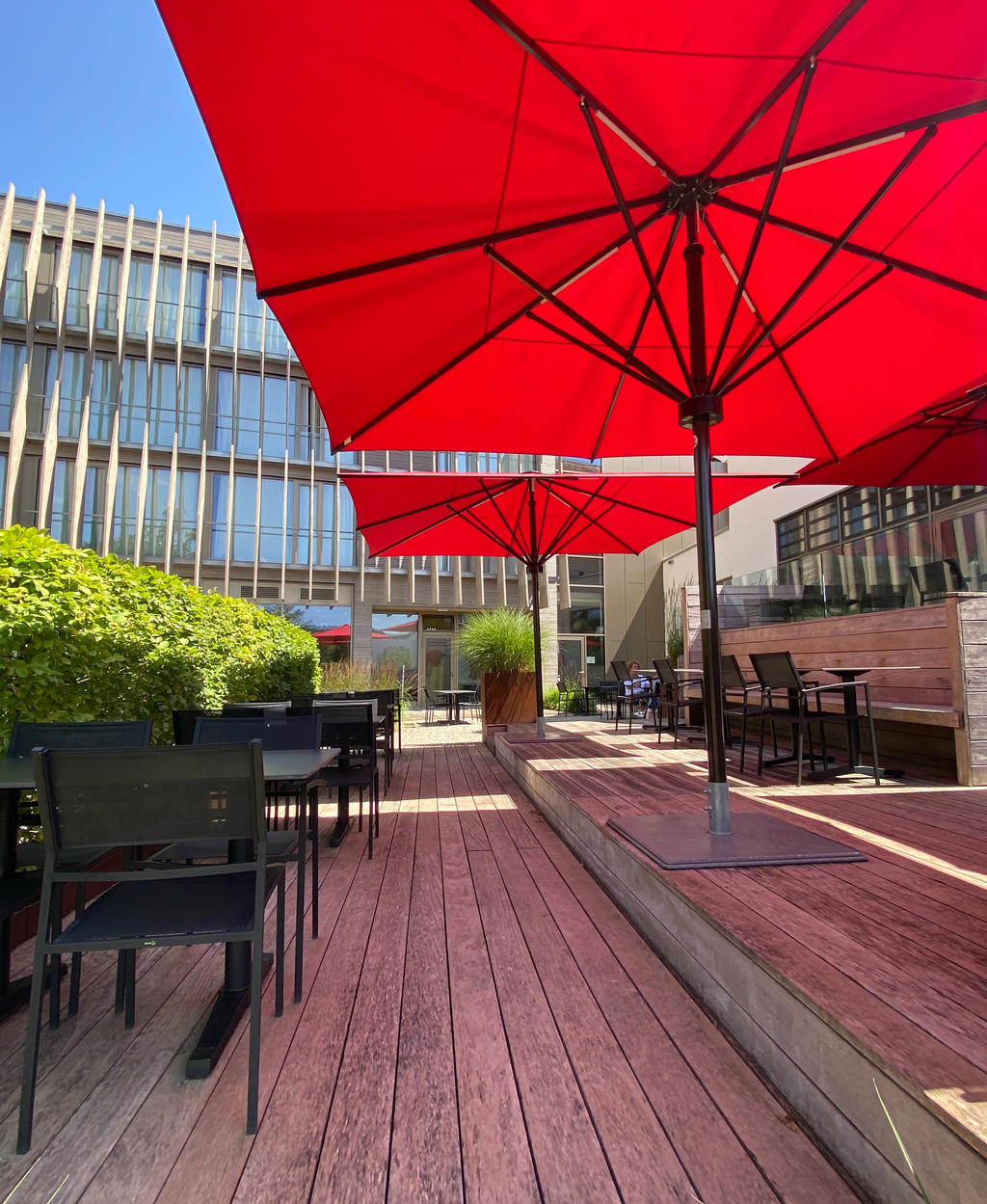 Terrace with red parasols