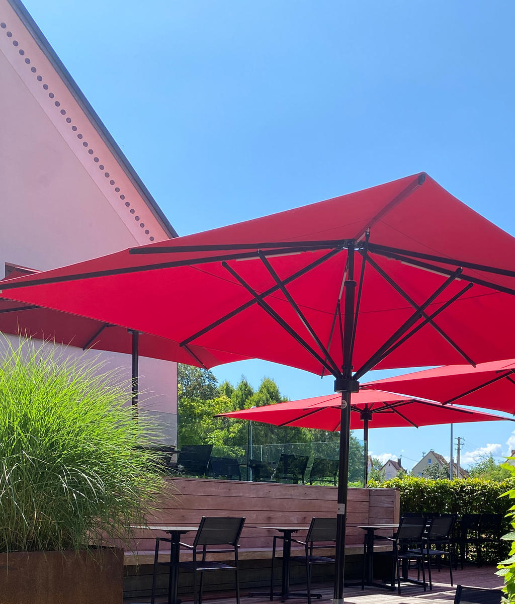 Terrace with red parasols