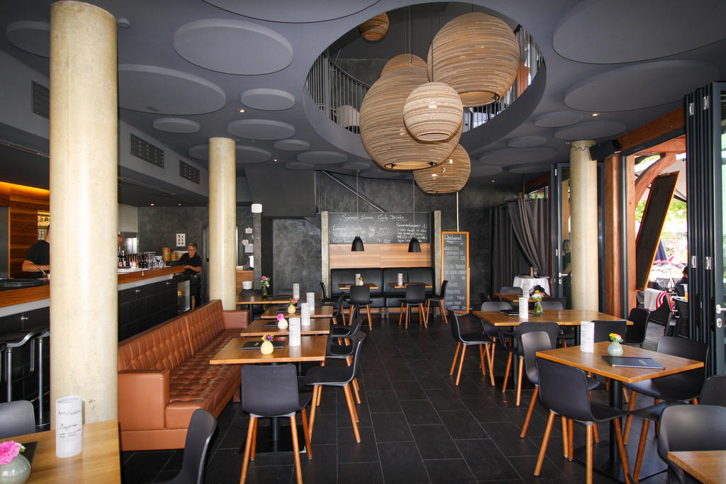 Patio with grey parasols