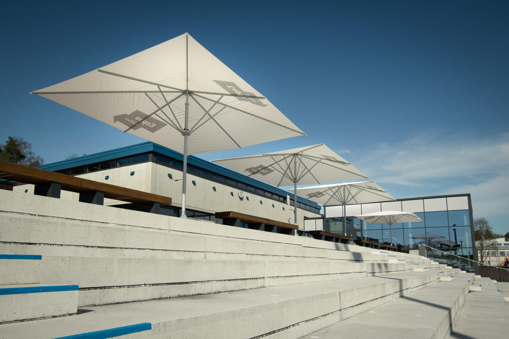 Leppävaara with white SCHATTELLO parasols Modern terrace with large white parasols.
