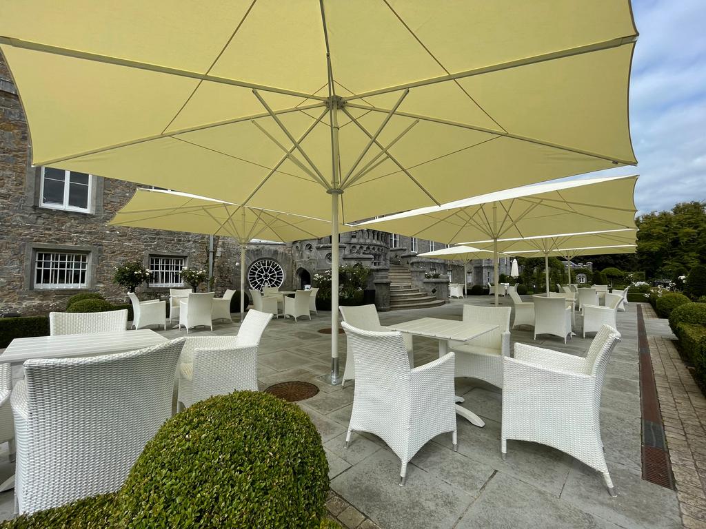 Markree Castle, Collooney Ireland with beige SCHATTELLO parasols Castle with a terrace and beige parasols