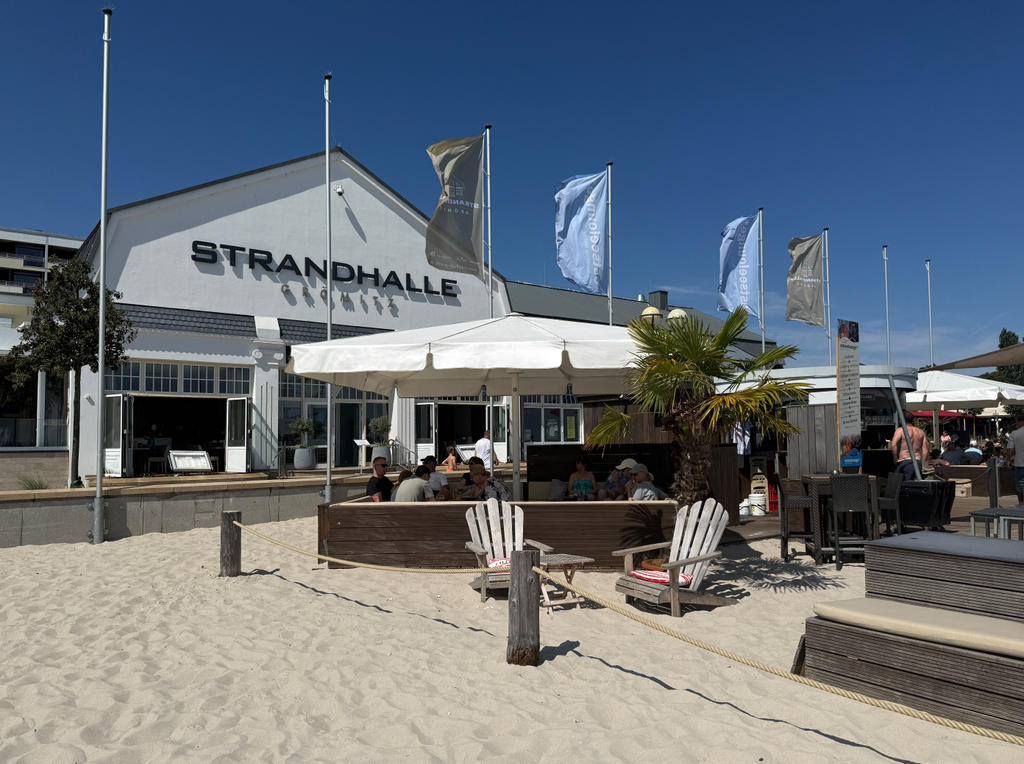Beach restaurant with white parasols