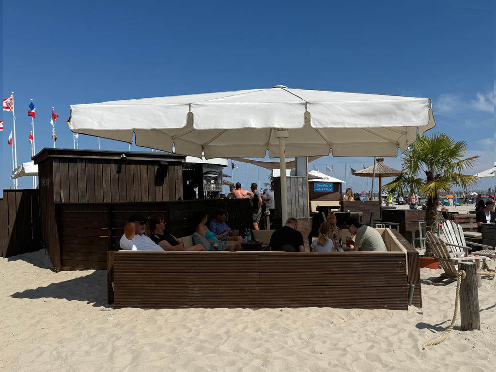 Beach restaurant with white parasols