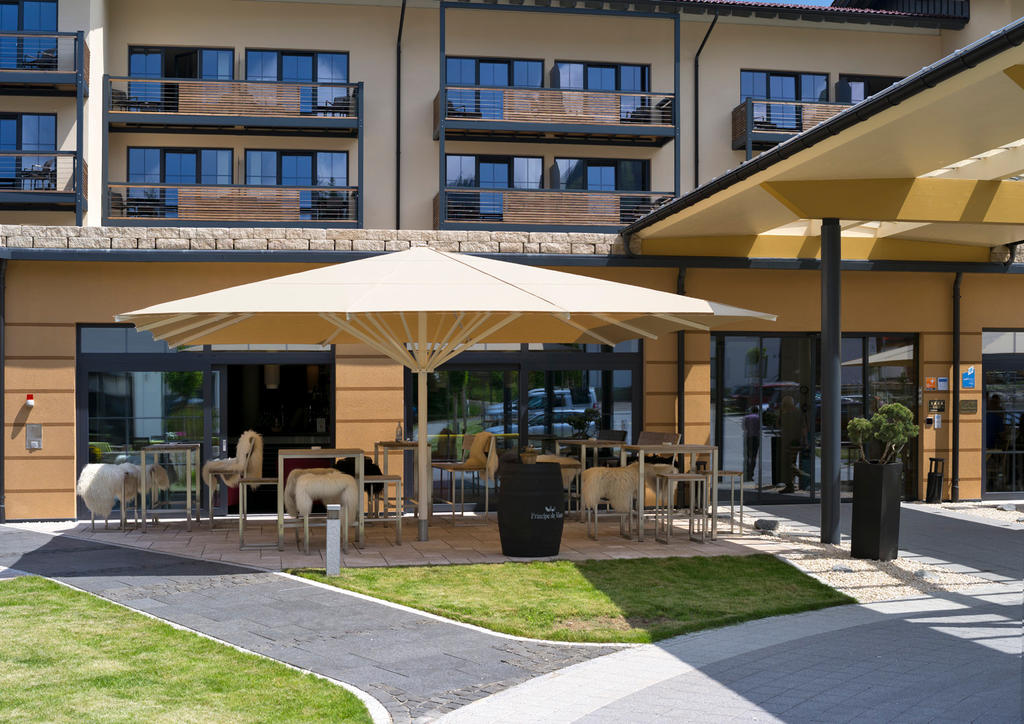 Hotel terrace with light-yellow parasols