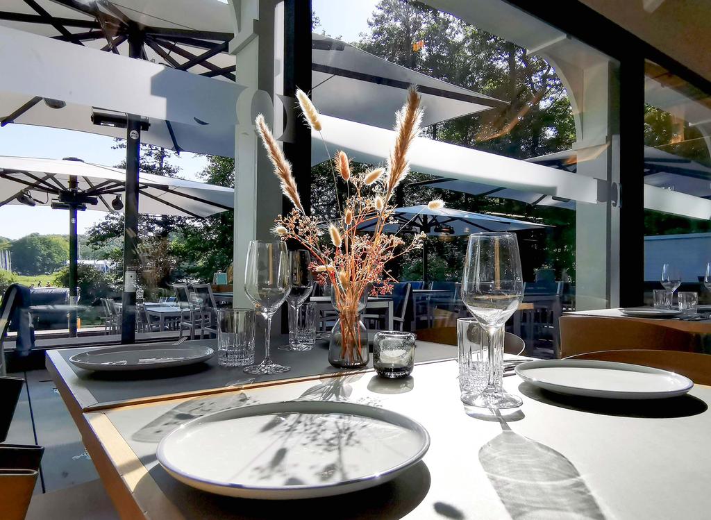 Terrace with white parasols